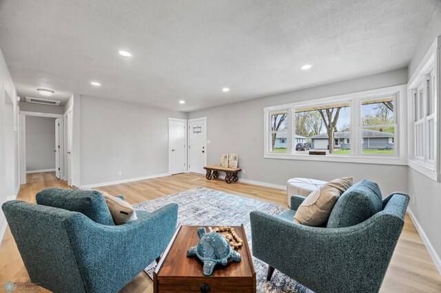 221 26th Ave N, Fargo, ND 58102 - living area featuring recessed lighting, light wood-style flooring, baseboards, and attic access