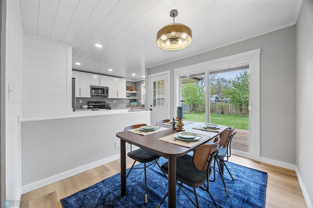 221 26th Ave N, Fargo, ND 58102 - dining room with recessed lighting, light wood finished floors, baseboards, wood ceiling, and ornamental molding