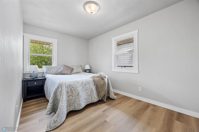 221 26th Ave N, Fargo, ND 58102 - bedroom featuring baseboards and wood finished floors