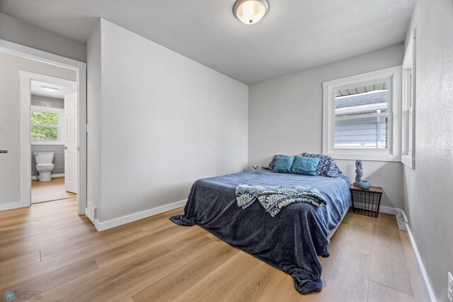 221 26th Ave N, Fargo, ND 58102 - bedroom with light wood-type flooring and baseboards