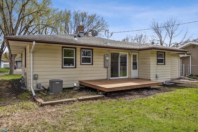 221 26th Ave N, Fargo, ND 58102 - back of property featuring a wooden deck, central air condition unit, and a chimney