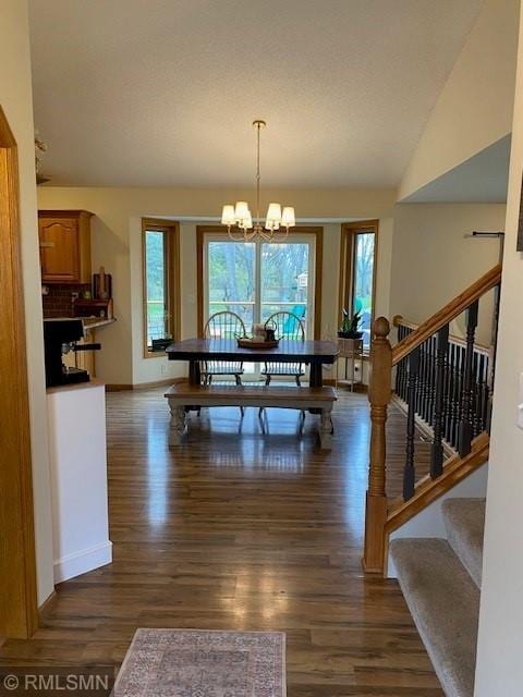 dining room with stairs, baseboards, a healthy amount of sunlight, and dark wood-type flooring