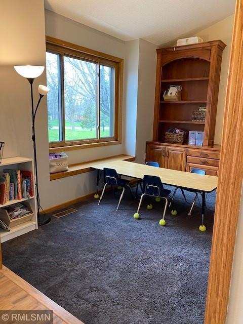 carpeted office with baseboards