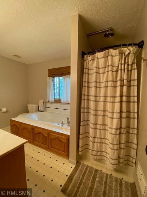 bathroom featuring a garden tub, a textured ceiling, visible vents, vanity, and a shower with shower curtain