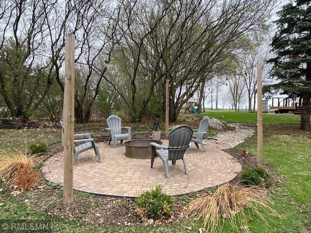 view of patio / terrace with an outdoor fire pit