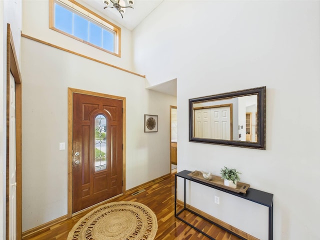 2200 Orchid Dr NE, Sauk Rapids, MN 56379 - entrance foyer featuring plenty of natural light, an inviting chandelier, a high ceiling, and wood finished floors