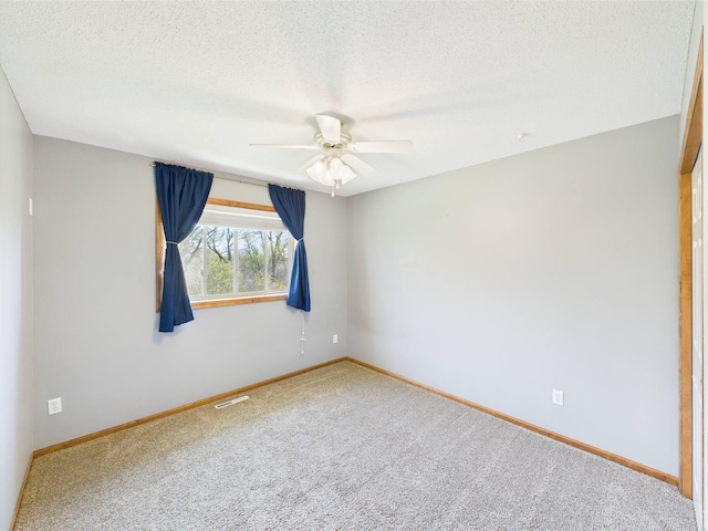 2200 Orchid Dr NE, Sauk Rapids, MN 56379 - carpeted empty room with a textured ceiling, visible vents, baseboards, and a ceiling fan
