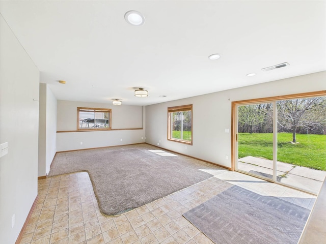 2200 Orchid Dr NE, Sauk Rapids, MN 56379 - unfurnished living room with baseboards, visible vents, and recessed lighting