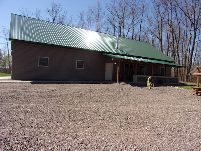 exterior space featuring metal roof