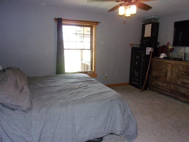 bedroom featuring ceiling fan and light carpet
