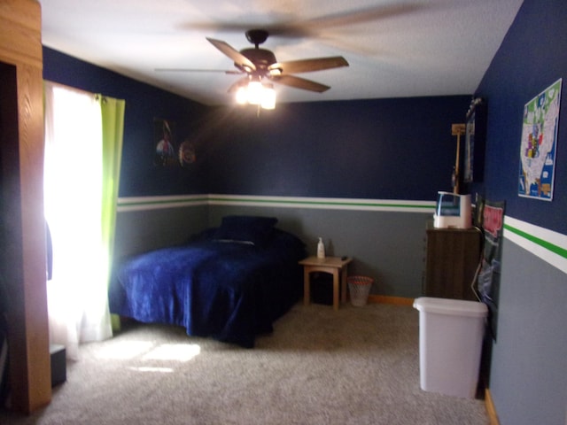 carpeted bedroom with a ceiling fan