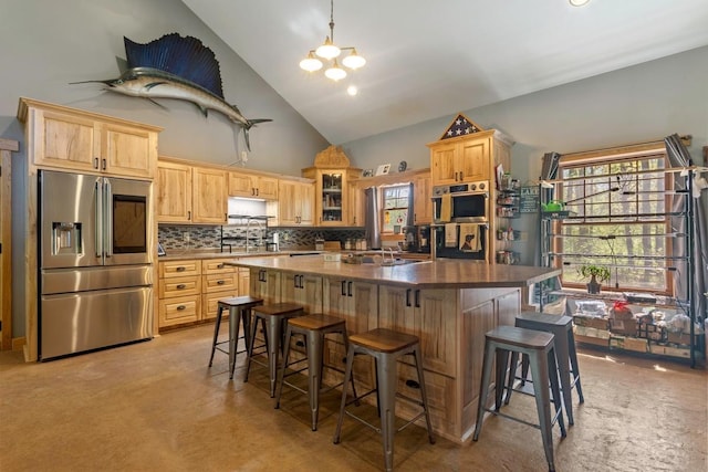 28667 Quarry St, Brook Park, MN 55007 - kitchen featuring stainless steel fridge, high vaulted ceiling, a kitchen island, light carpet, and light brown cabinetry