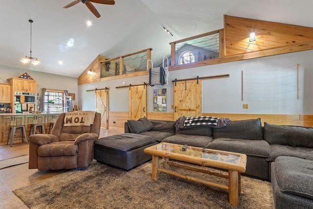 28667 Quarry St, Brook Park, MN 55007 - living area featuring a barn door, high vaulted ceiling, and ceiling fan