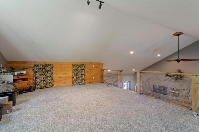 28667 Quarry St, Brook Park, MN 55007 - unfurnished living room with vaulted ceiling, carpet, wood walls, and a ceiling fan