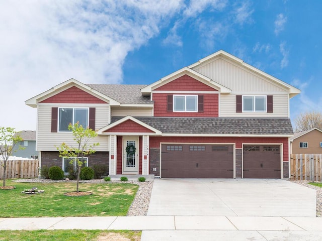 view of front of home featuring fence, driveway, a garage, a front yard, and a shingled roof