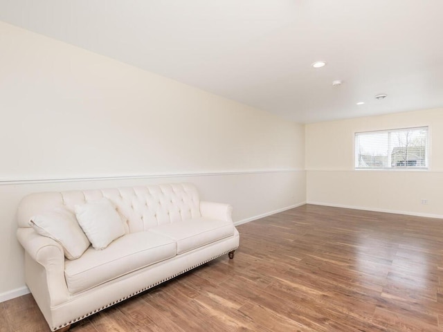 sitting room with baseboards, recessed lighting, and wood finished floors