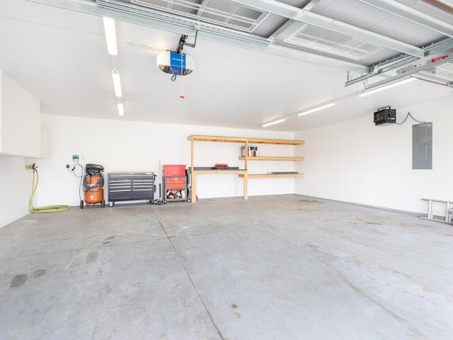 garage featuring electric panel and a garage door opener