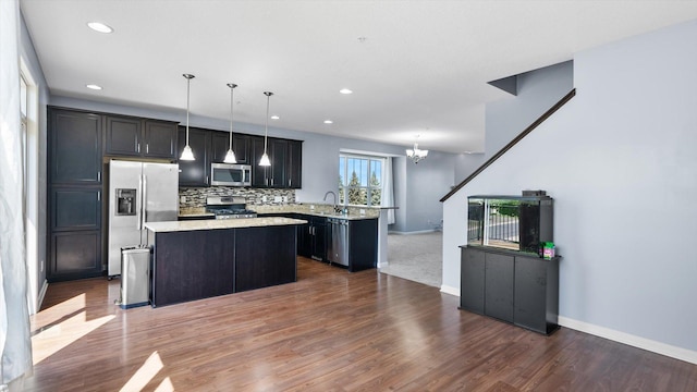 9645 Scott Ln N Unit 32, Brooklyn Park, MN 55443 - kitchen with appliances with stainless steel finishes, a center island, a chandelier, dark wood finished floors, and recessed lighting