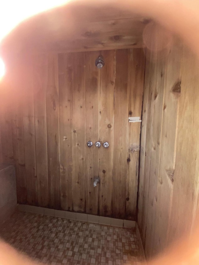 39 Erie St, Aurora, MN 55705 - interior space featuring wood walls and tile patterned floors