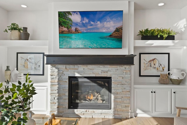 4181 Arbor Dr, Woodbury, MN 55129 - living area featuring a stone fireplace and wood finished floors