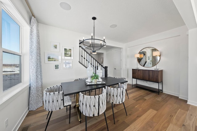4181 Arbor Dr, Woodbury, MN 55129 - dining room featuring baseboards, a chandelier, and wood finished floors