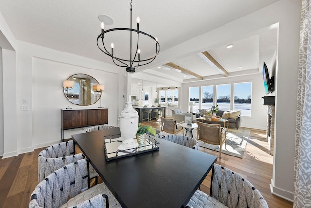 4181 Arbor Dr, Woodbury, MN 55129 - dining space with baseboards, beam ceiling, wood finished floors, and a chandelier