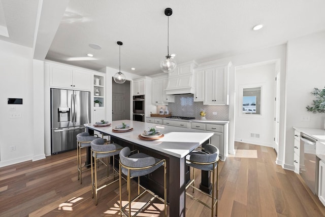 4181 Arbor Dr, Woodbury, MN 55129 - kitchen with open shelves, white cabinetry, appliances with stainless steel finishes, and wood finished floors