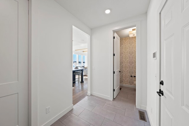 4181 Arbor Dr, Woodbury, MN 55129 - hall featuring recessed lighting, baseboards, visible vents, and light tile patterned flooring