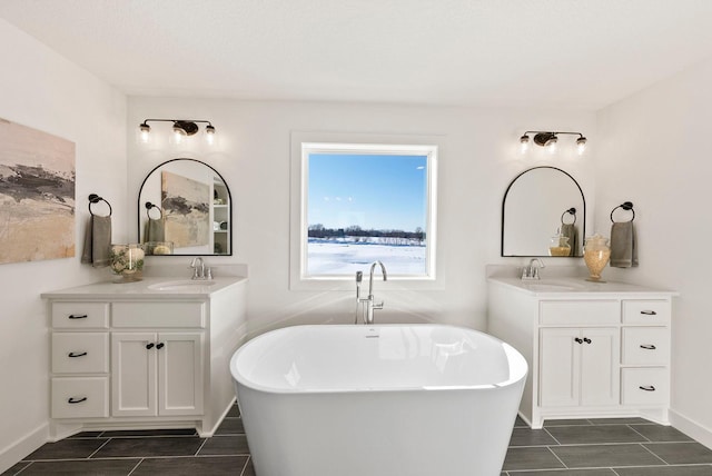 4181 Arbor Dr, Woodbury, MN 55129 - bathroom with a sink, two vanities, and a freestanding tub