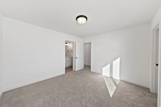 4181 Arbor Dr, Woodbury, MN 55129 - unfurnished bedroom with carpet floors, baseboards, and ensuite bathroom