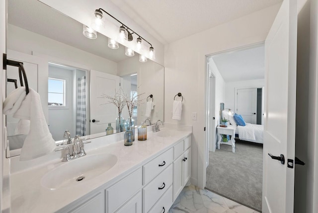 4181 Arbor Dr, Woodbury, MN 55129 - bathroom with marble finish floor, connected bathroom, double vanity, and a sink