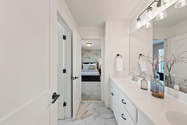 4181 Arbor Dr, Woodbury, MN 55129 - bathroom featuring marble finish floor, ensuite bathroom, double vanity, and a sink
