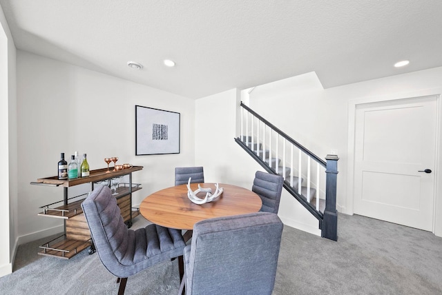4181 Arbor Dr, Woodbury, MN 55129 - carpeted dining area with baseboards, stairs, and recessed lighting