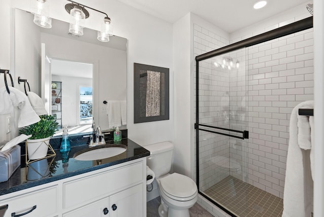 4181 Arbor Dr, Woodbury, MN 55129 - bathroom featuring vanity, toilet, and a stall shower