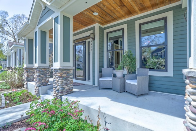 view of exterior entry featuring a porch