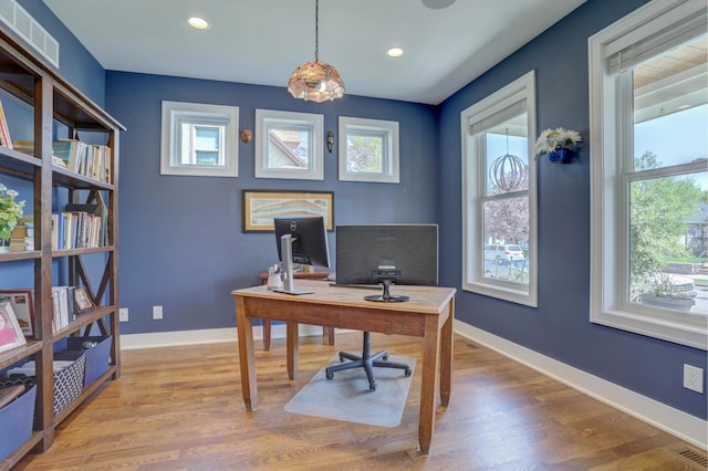 home office with visible vents, wood finished floors, baseboards, and recessed lighting
