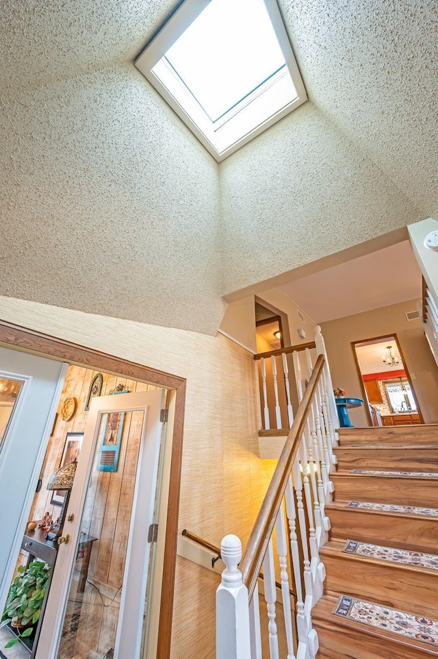 stairway with a skylight