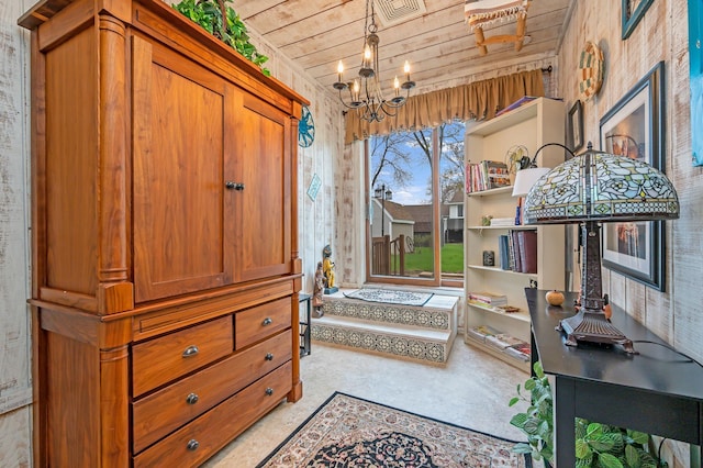 living area with a notable chandelier, wooden ceiling, and visible vents