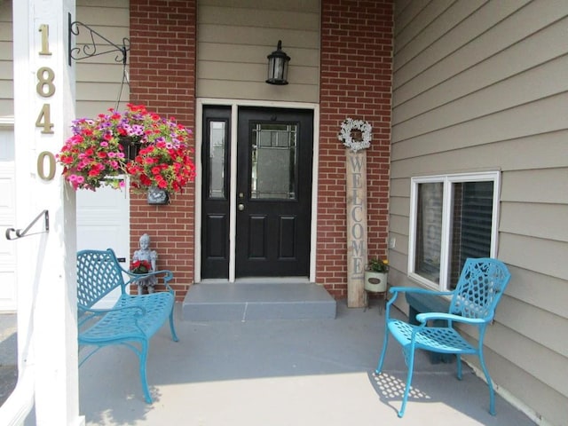 1840 Red Leaf Ct, Windom, MN 56101 - entrance to property featuring brick siding and a porch
