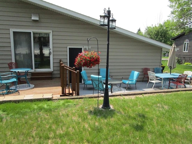 1840 Red Leaf Ct, Windom, MN 56101 - rear view of property featuring a deck and a yard
