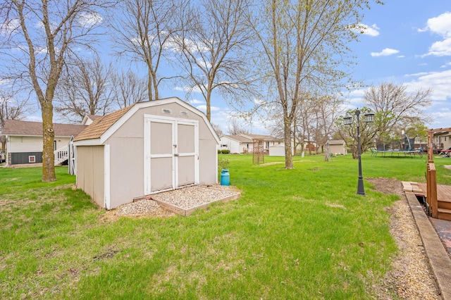 1840 Red Leaf Ct, Windom, MN 56101 - view of green lawn with a trampoline and a residential view