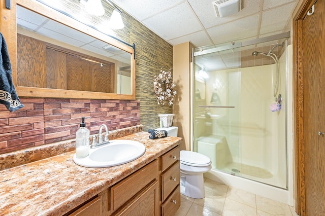 1840 Red Leaf Ct, Windom, MN 56101 - full bathroom featuring a paneled ceiling, a shower stall, vanity, toilet, and tile patterned floors