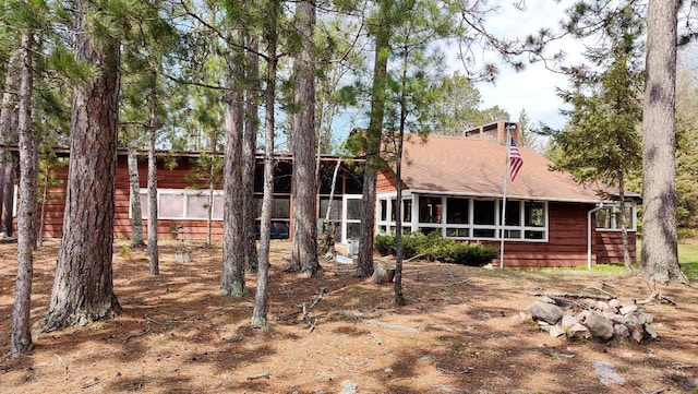 back of property featuring a sunroom