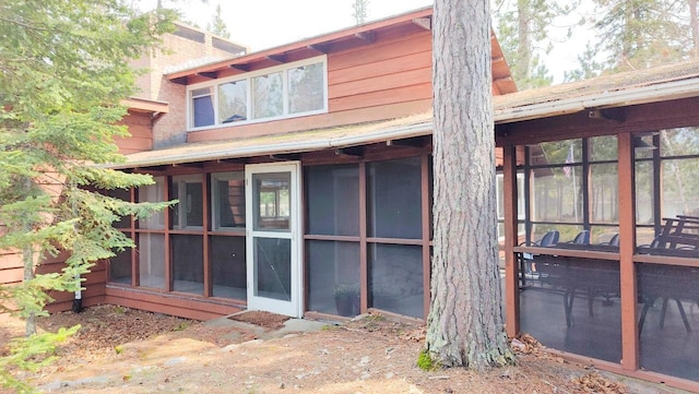 rear view of house with a sunroom