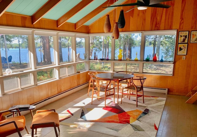 sunroom / solarium featuring wooden walls, a water view, and lofted ceiling