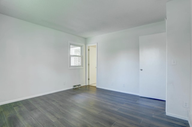 2401 Brookview Dr, Burnsville, MN 55337 - unfurnished room featuring dark wood-type flooring and baseboards