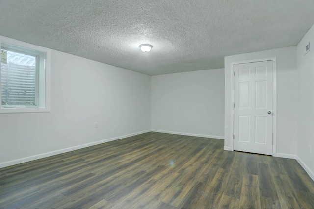 2401 Brookview Dr, Burnsville, MN 55337 - spare room with a textured ceiling, dark wood-style flooring, and baseboards