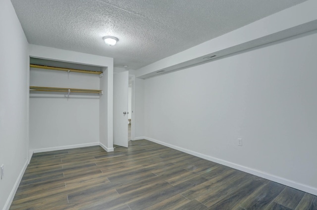 2401 Brookview Dr, Burnsville, MN 55337 - unfurnished bedroom with a textured ceiling, wood finished floors, a closet, and baseboards