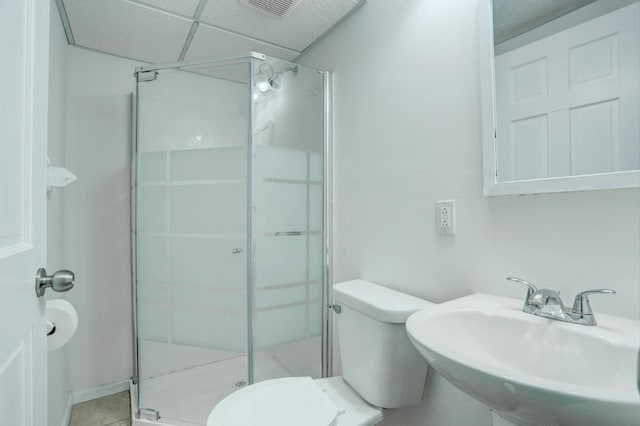 2401 Brookview Dr, Burnsville, MN 55337 - full bathroom featuring a sink, a shower stall, toilet, and tile patterned flooring