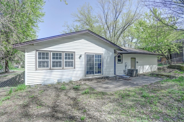 2401 Brookview Dr, Burnsville, MN 55337 - rear view of house with fence, a patio area, and central air condition unit